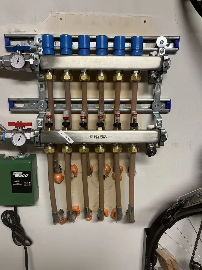 Plumber performing Water Heater Repair at a residential property in Brighton